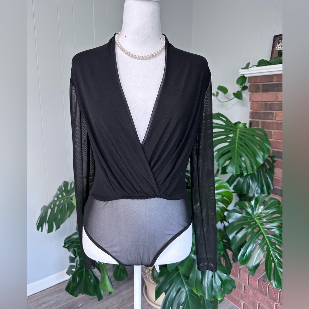 #9) Black mesh bodysuit size medium never worn excellent condition.
